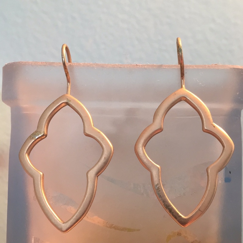 Faux gold earrings.